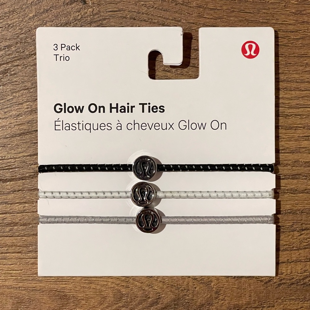 NWT Lululemon women’s “glow on hair ties” 3 pack. Brand new O/S Black White Gray
